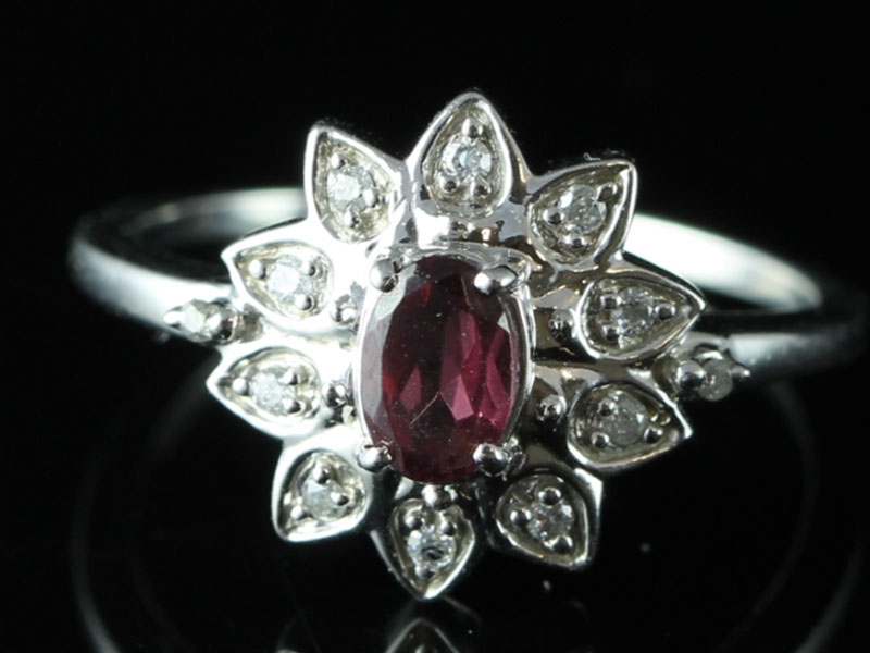 Elegant ruby and diamond cluster 9 carat gold ring 