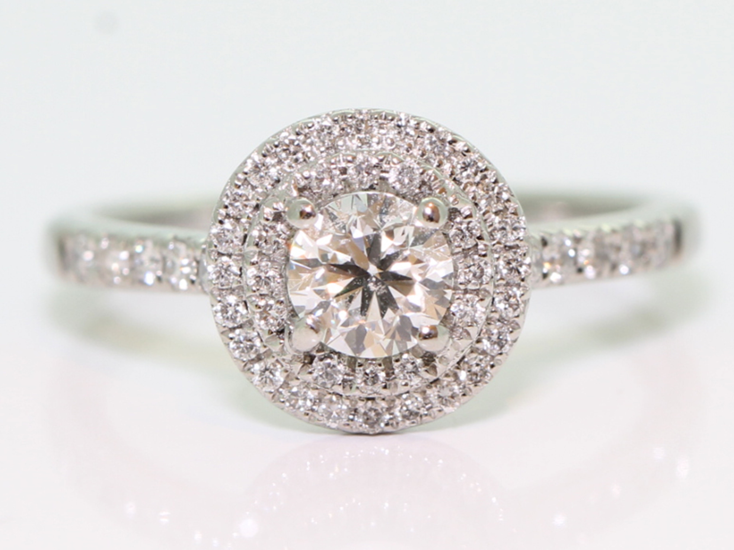 Celestial round center diamond double halo platinum ring