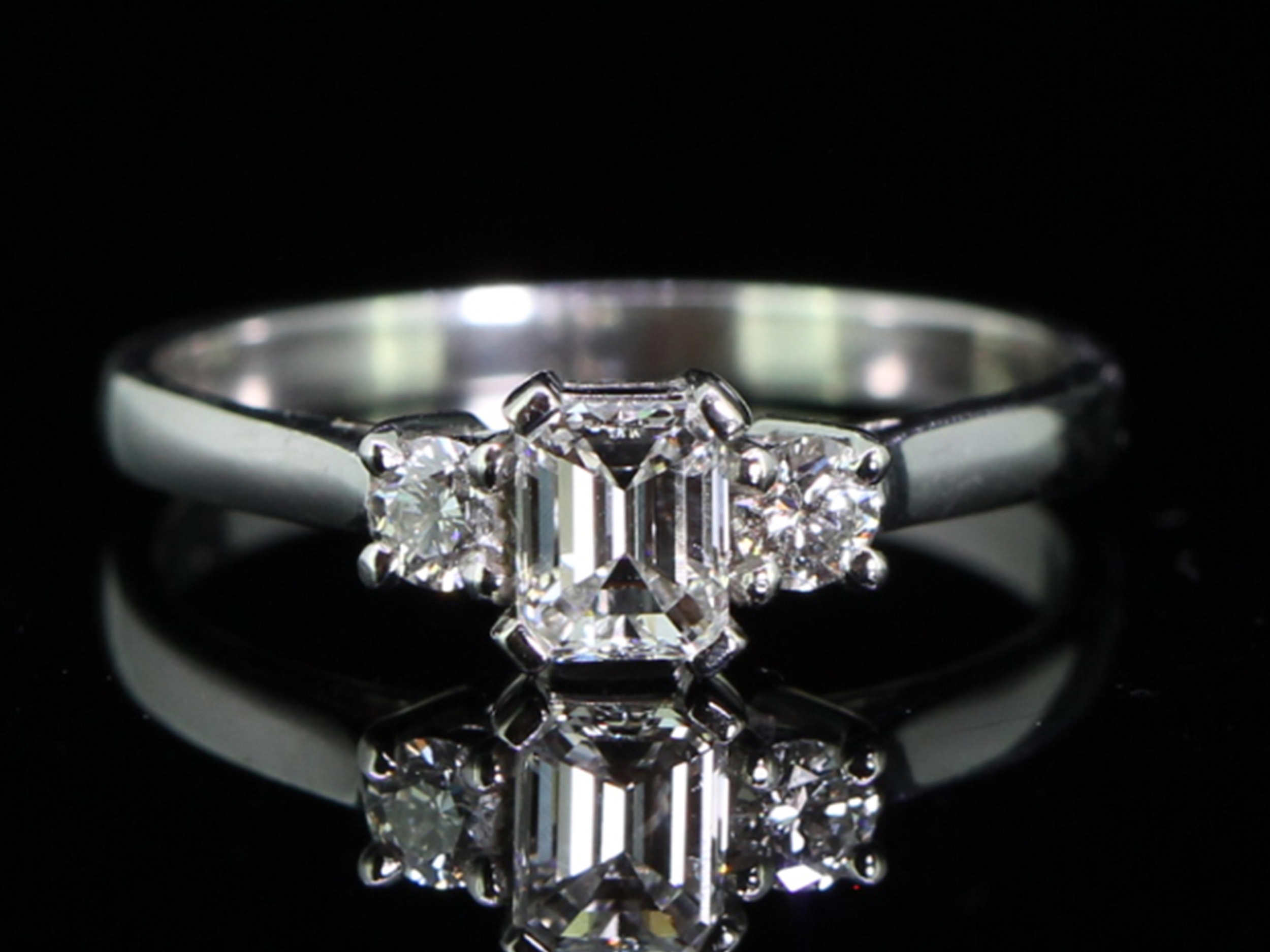 Beautiful emerald cut diamond platinum trilogy ring