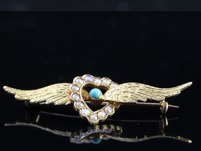 Stunning edwardian 15 carat seed pearl and tourquoise wing brooch