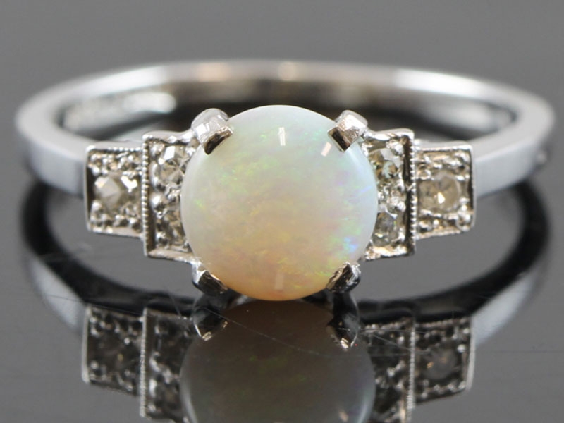  pretty opal and diamond 18 carat gold ring