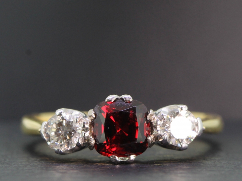 Stunning natural ruby and diamond 18 carat gold trilogy ring