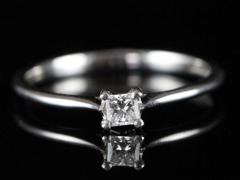 A classic princess cut solitaire diamond ring in 18 carat white gold