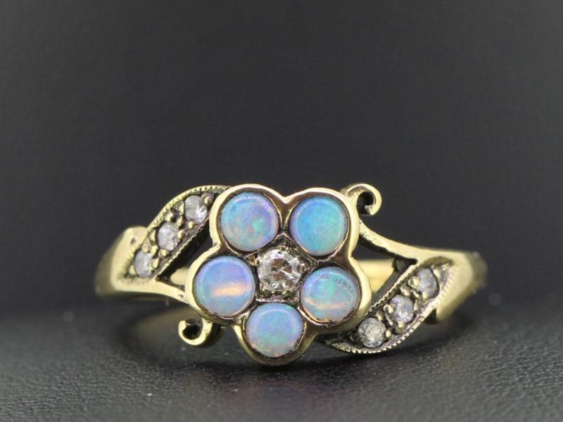 Colourful opal and diamond daisy 9 carat gold ring