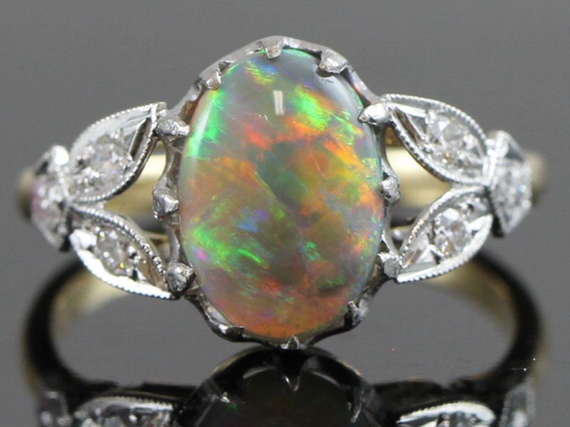 Wonderful opal and diamond 18 carat gold ring