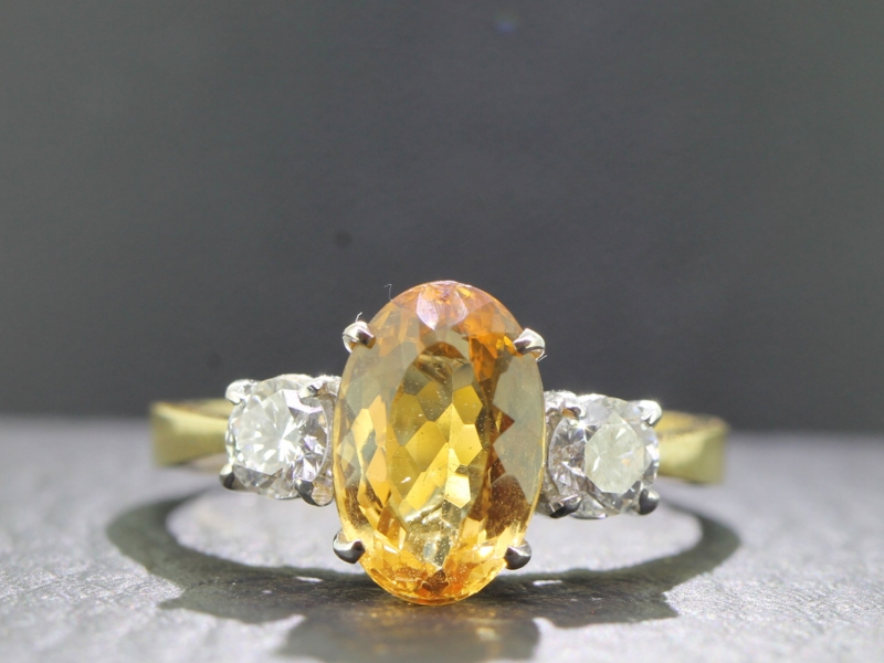 Fabulous imperial topaz and diamond trilogy 18 carat gold ring