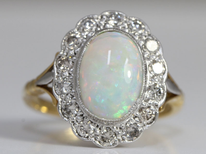  alluring opal and diamond 18 carat gold cluster ring