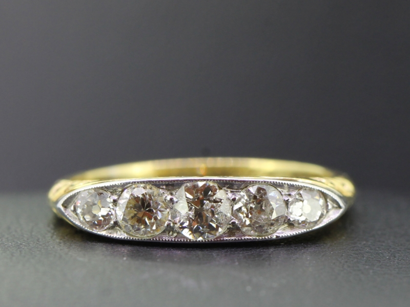 Romantically carved edwardian five stone half hoop ring