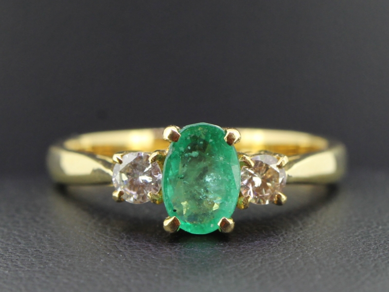 Stunning emerald and diamond trilogy 18 carat gold ring