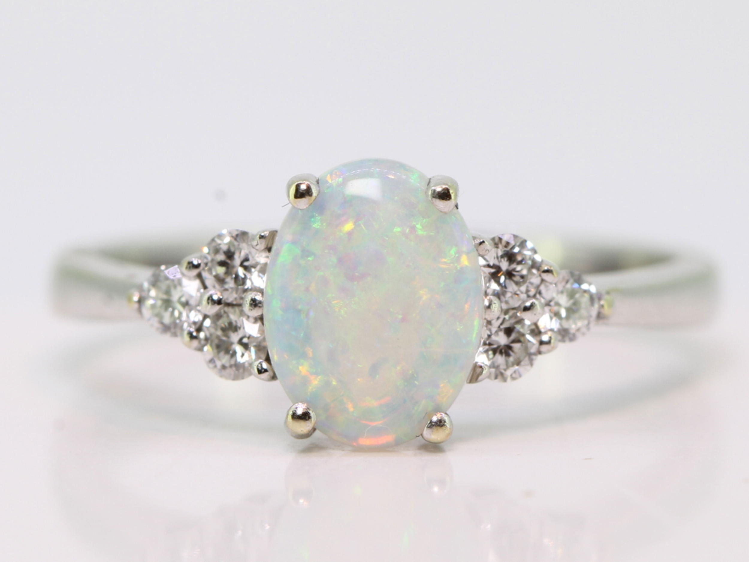 Pretty opal and diamond 14 carat gold ring
