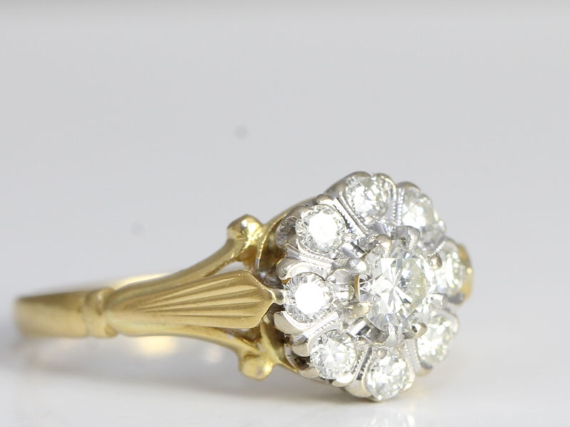 Wonderful diamond daisy 18 carat gold and platinum ring