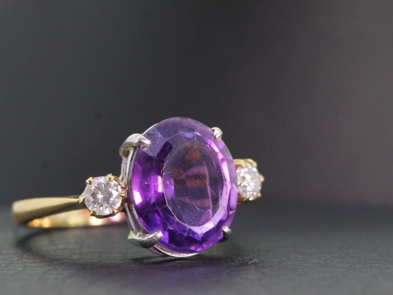Stunning amethyst and diamond trilogy 18 carat gold ring