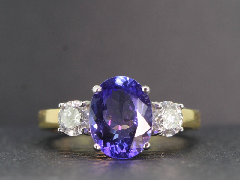 Magnificent aaa tanzanite and diamond 18 carat gold trilogy ring 