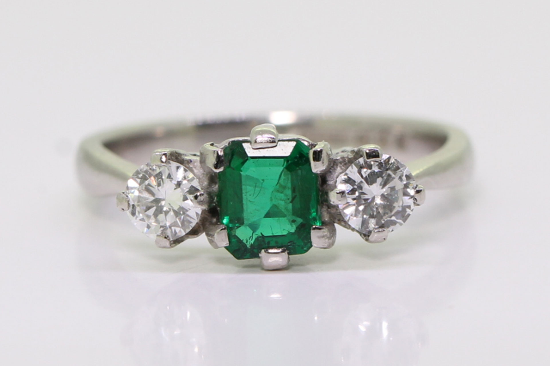 Vintage dates 1959 emerald and diamond platinum trilogy ring