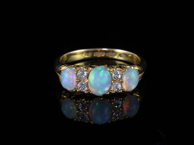 A stunning genuine edwardian australian opal and diamond 15ct ring