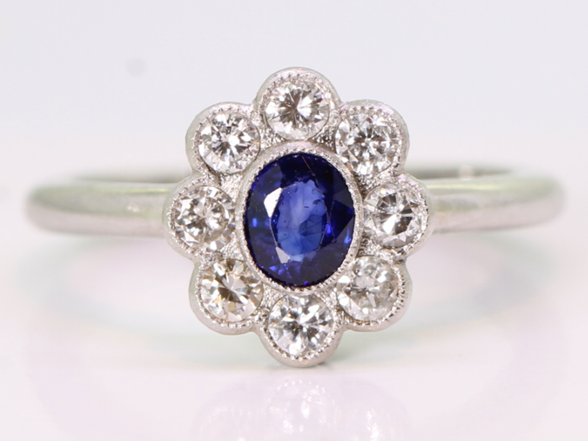 Vintage sapphire and diamond platinum cluster ring