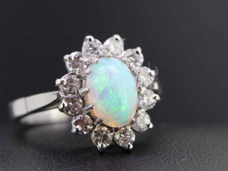 Stunning opal and diamond 18 carat gold ring