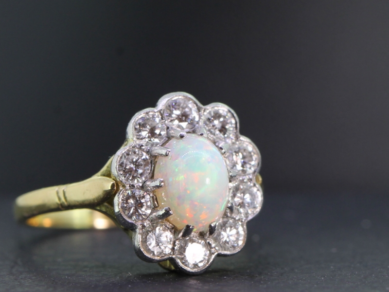 Pretty opal and diamond 18 carat gold and platinum cluster ring