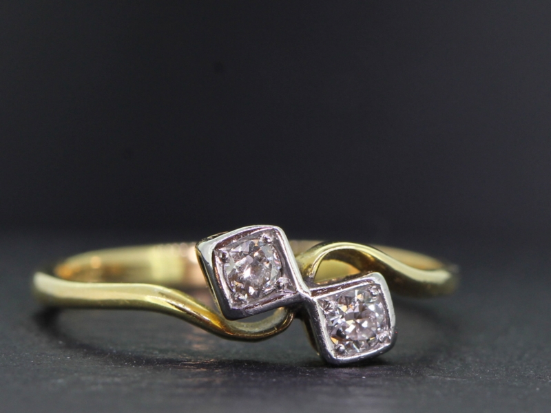 Pretty edwardian diamond on a twist platinum and 18 carat gold ring