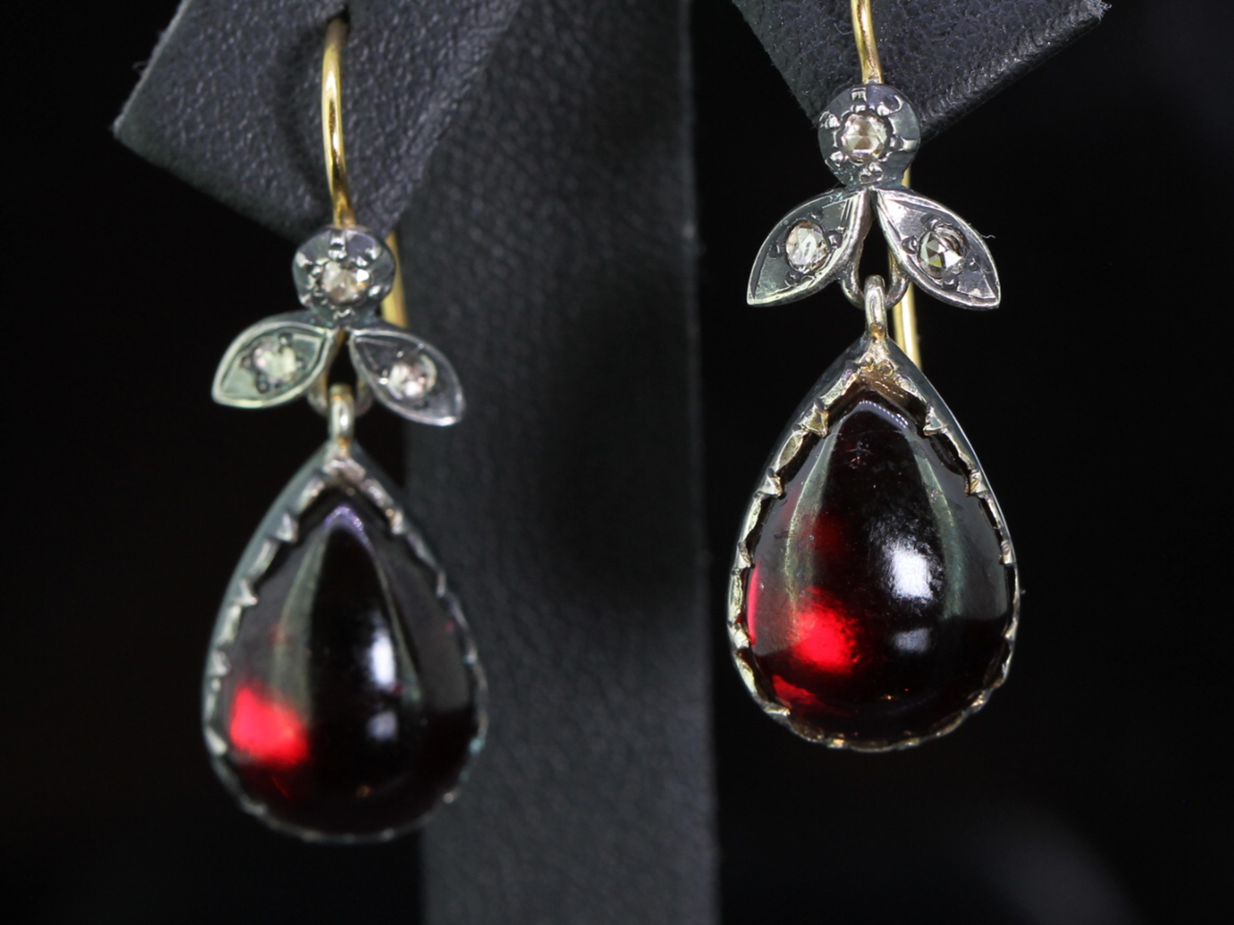Graceful bohemium garnet and diamond drop silver set earrings with 9 carat gold hooks