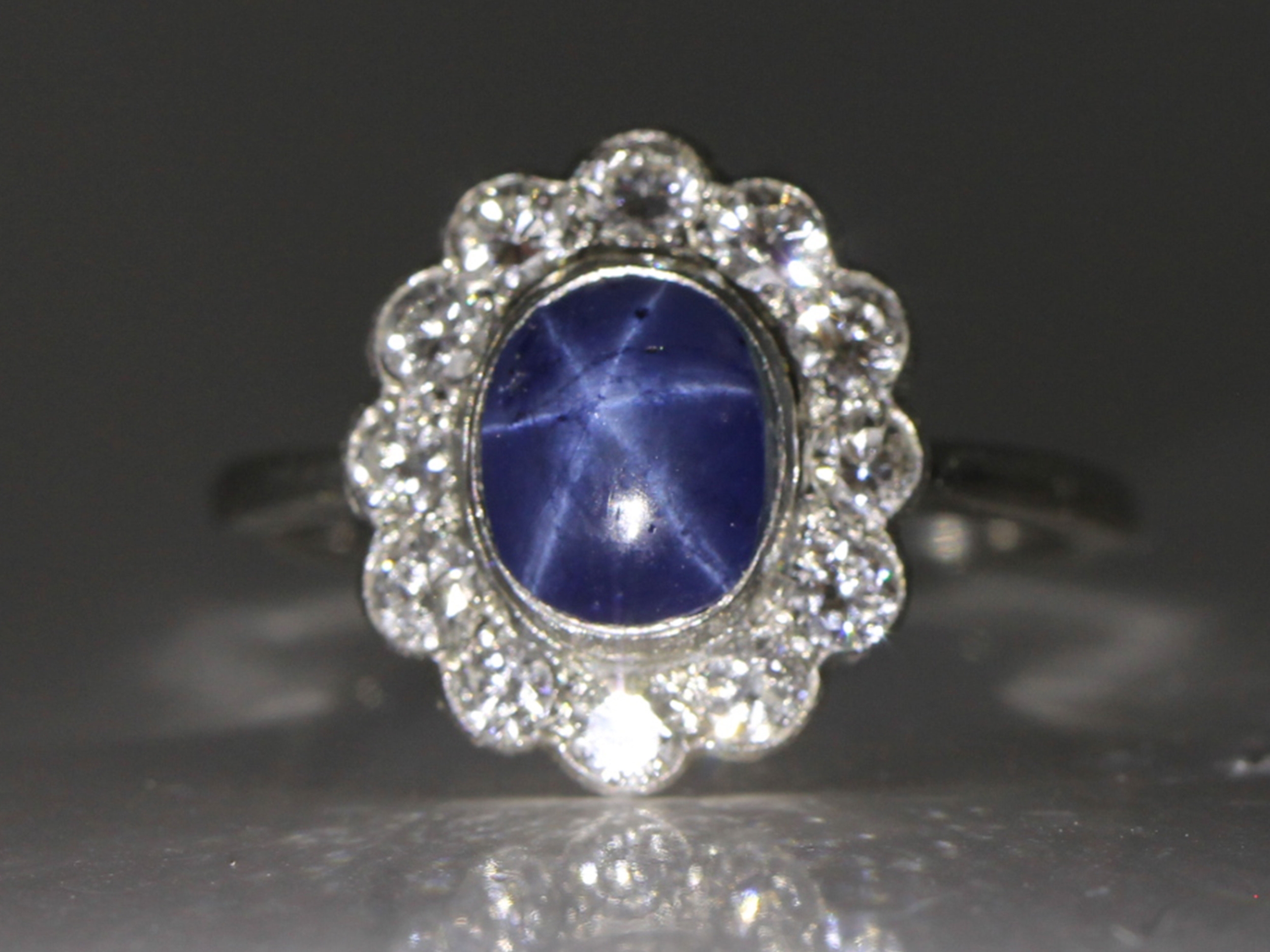 Vintage star sapphire and diamond cluster platinum ring 