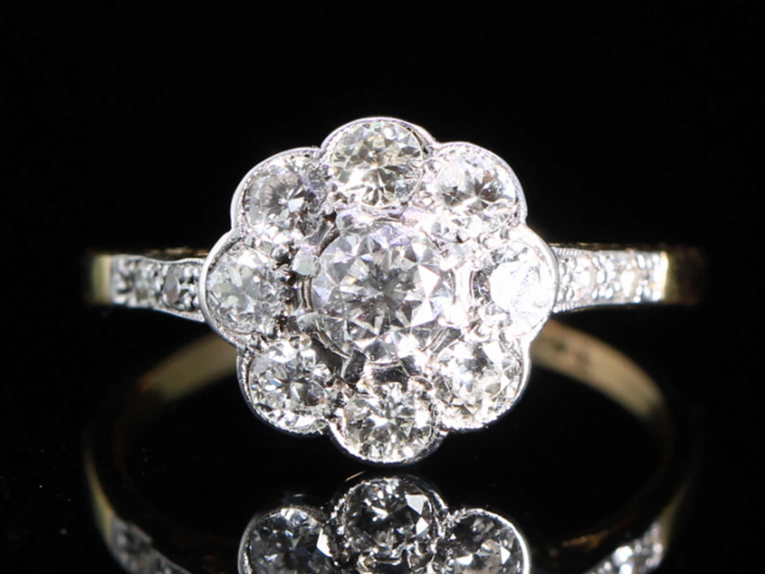 Art deco diamond platinum and 18ct gold daisy ring