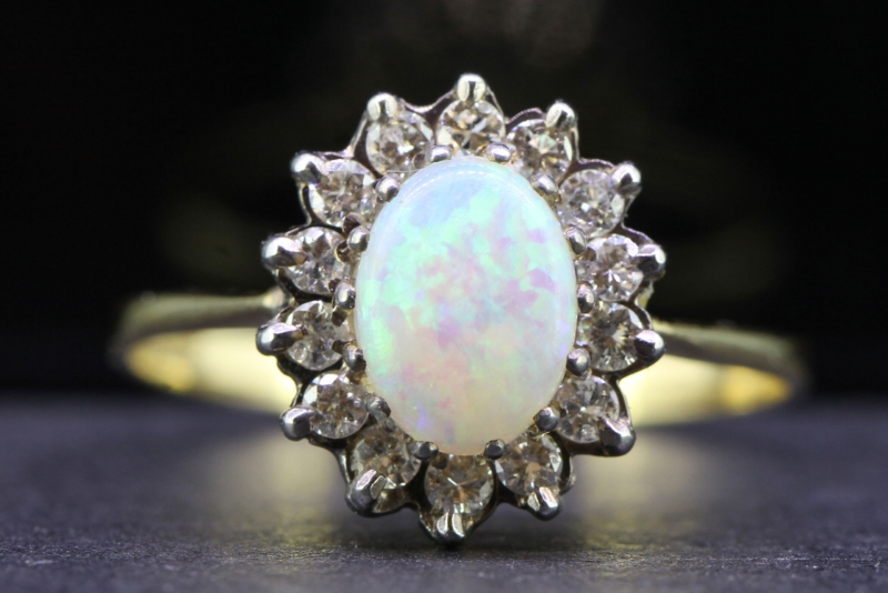 Gorgeous opal and diamond 18 carat gold ring