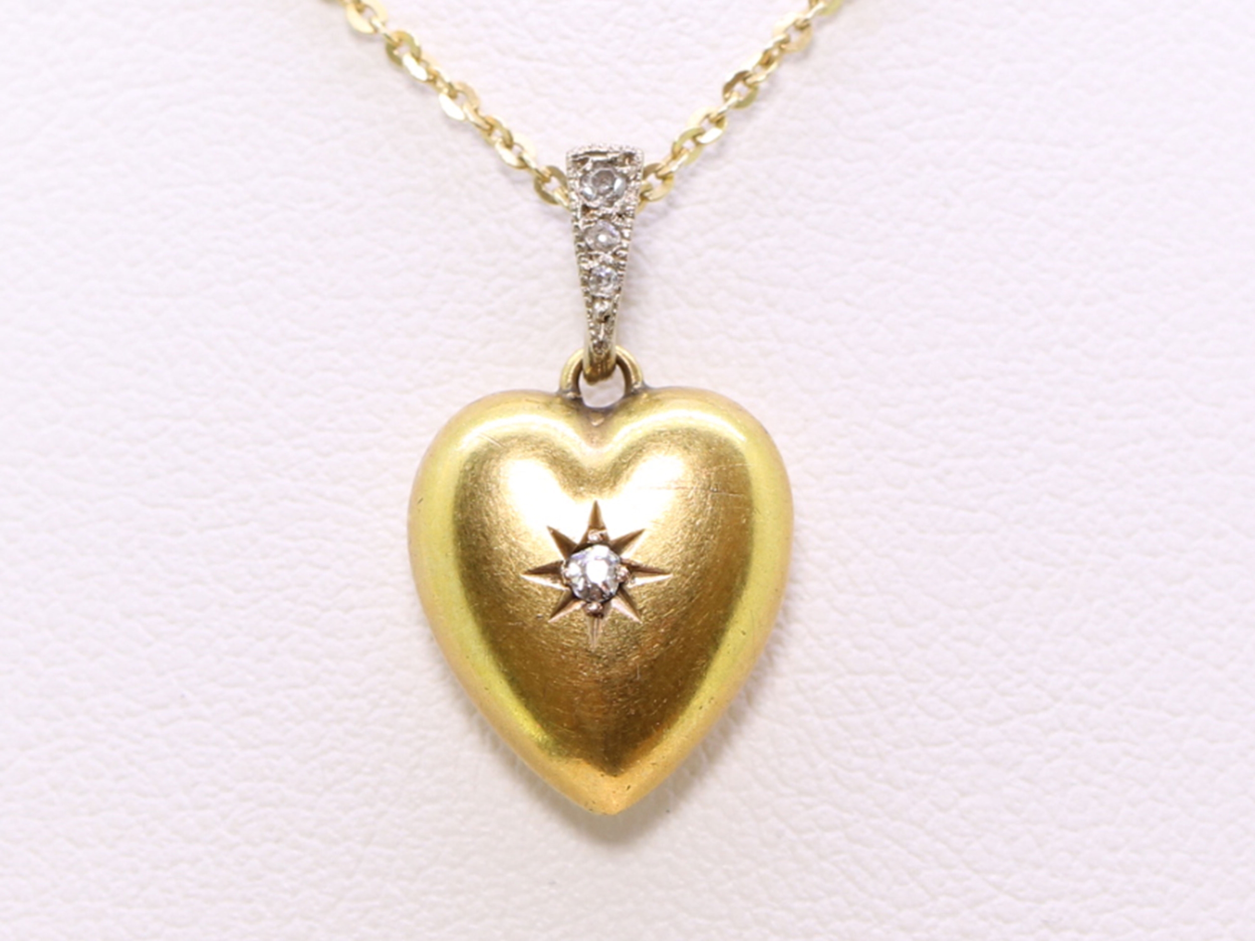 Edwardian 15ct gold and diamond heart shaped pendant 