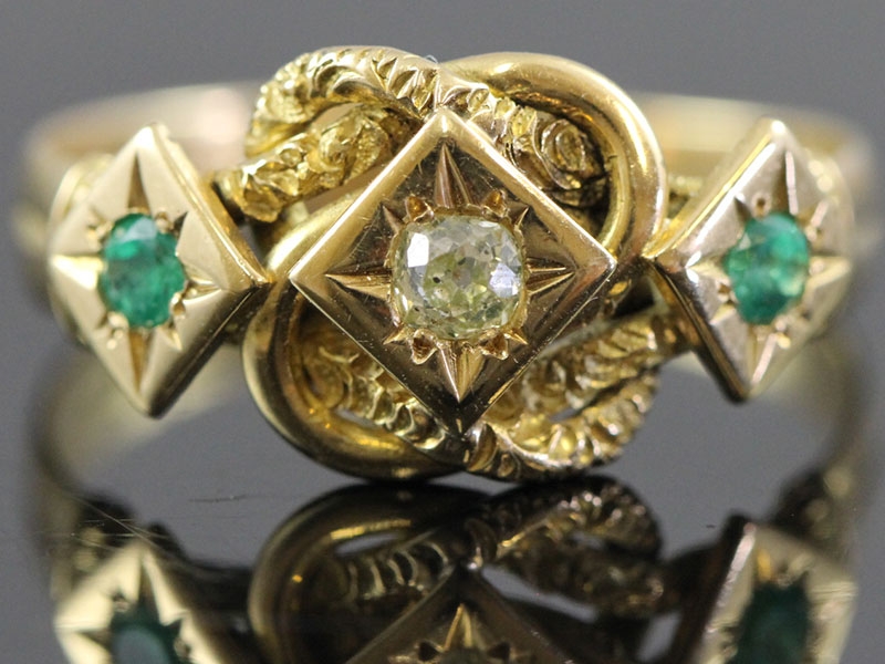 Wonderful diamond and emerald 18 carat gold knot ring