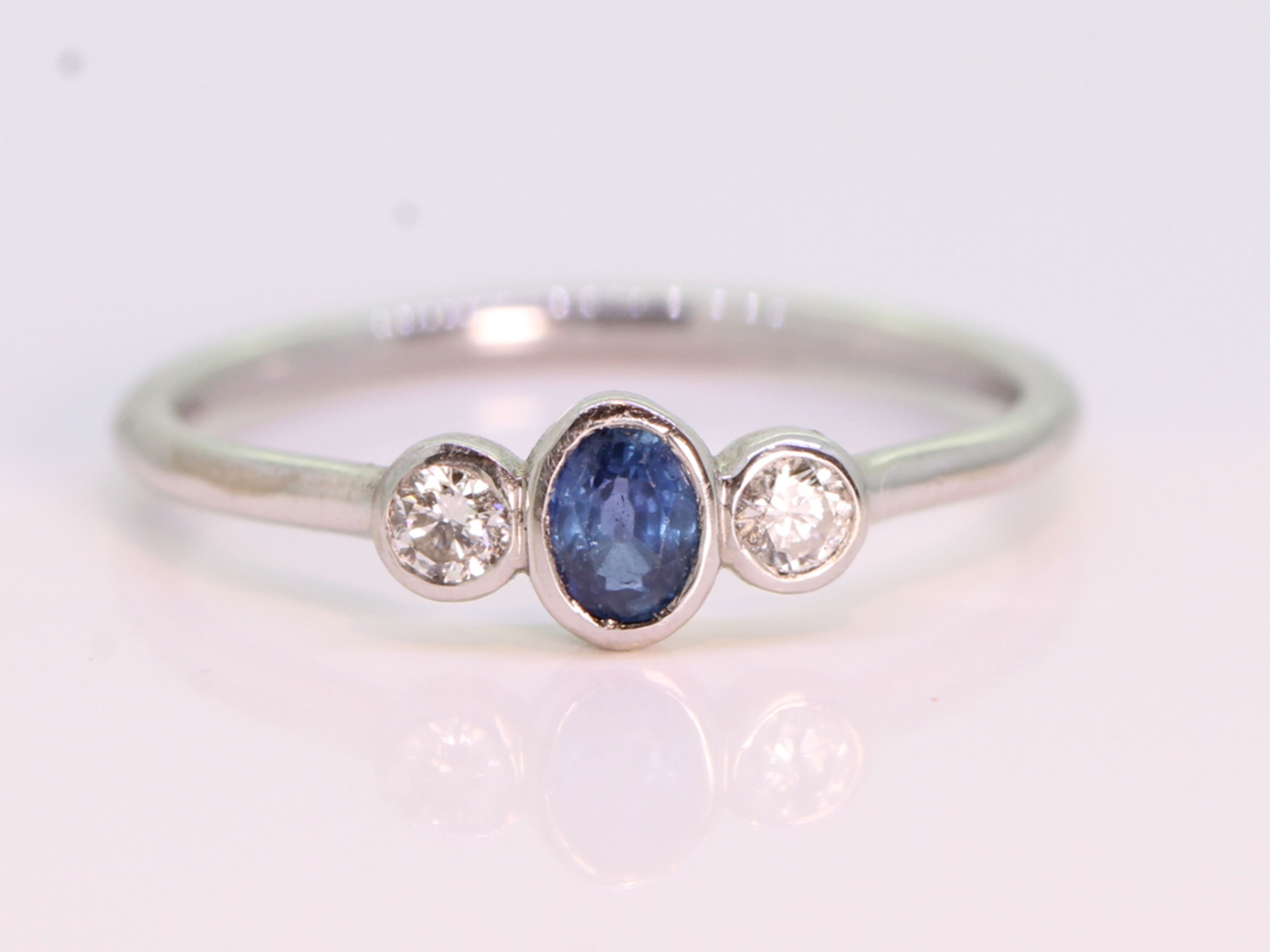 Contemporary sapphire and diamond trilogy 14ct gold ring