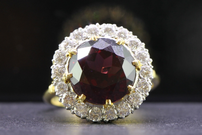 Magnificent 8.7 carat rhodolite and diamond 18 carat gold halo ring