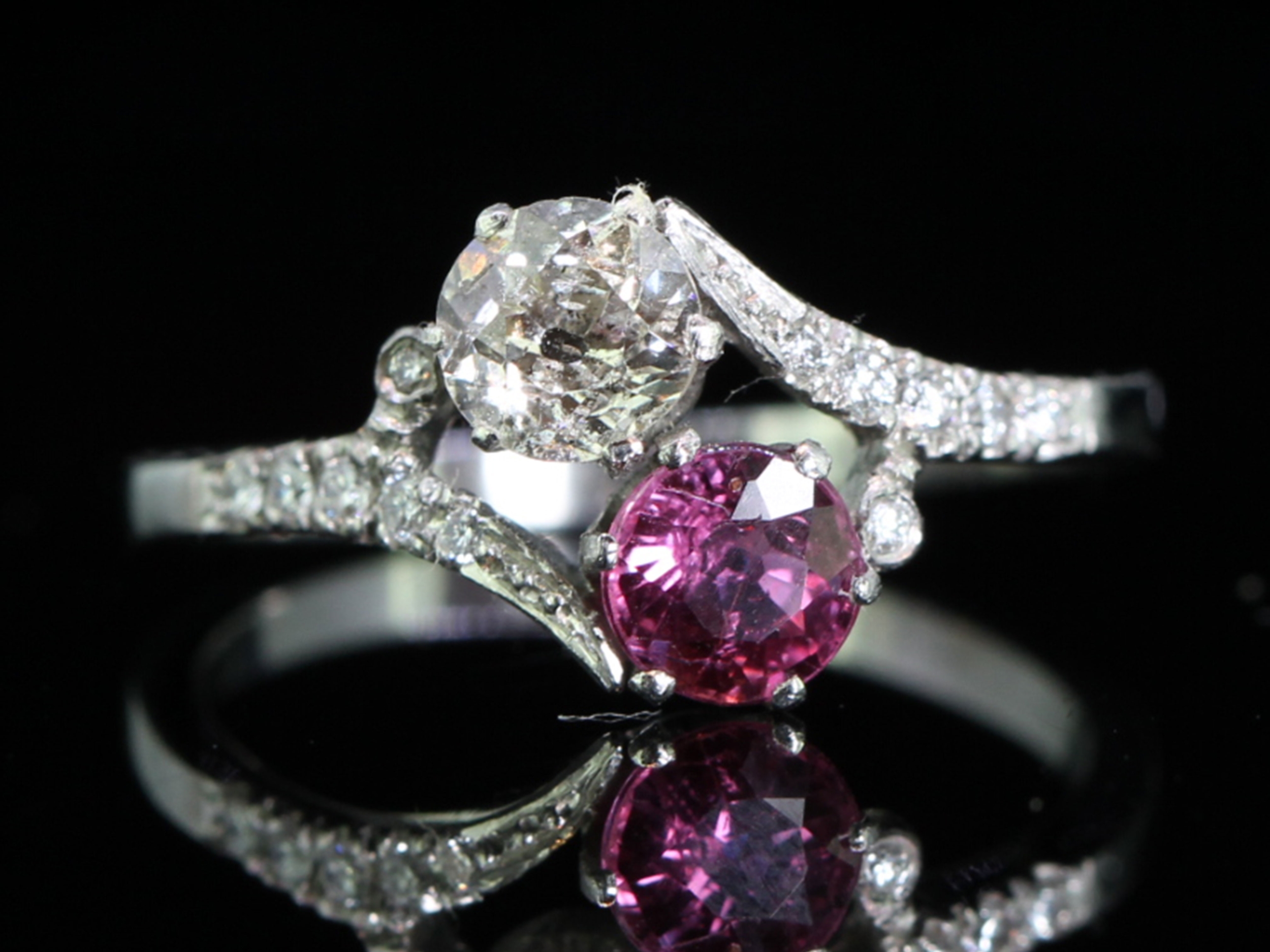 Elegant ruby and diamond on a twist platinum ring