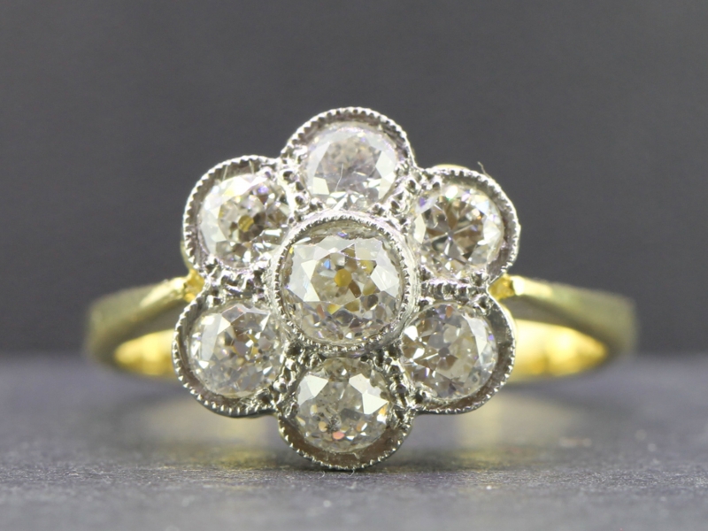Stunning vintage diamond daisy platinum and 18 carat gold ring