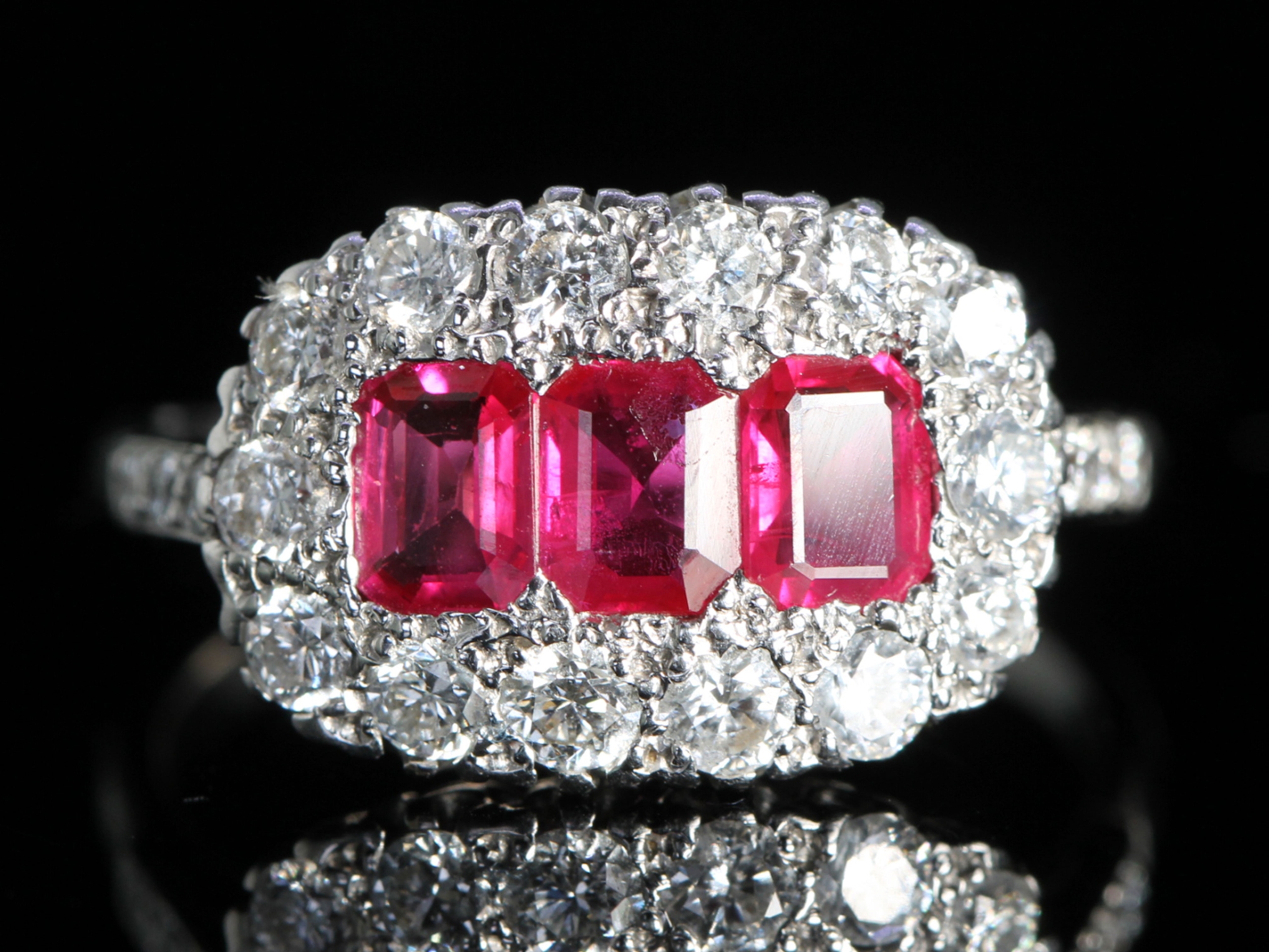 Art deco ruby and diamond platinum cluster ring