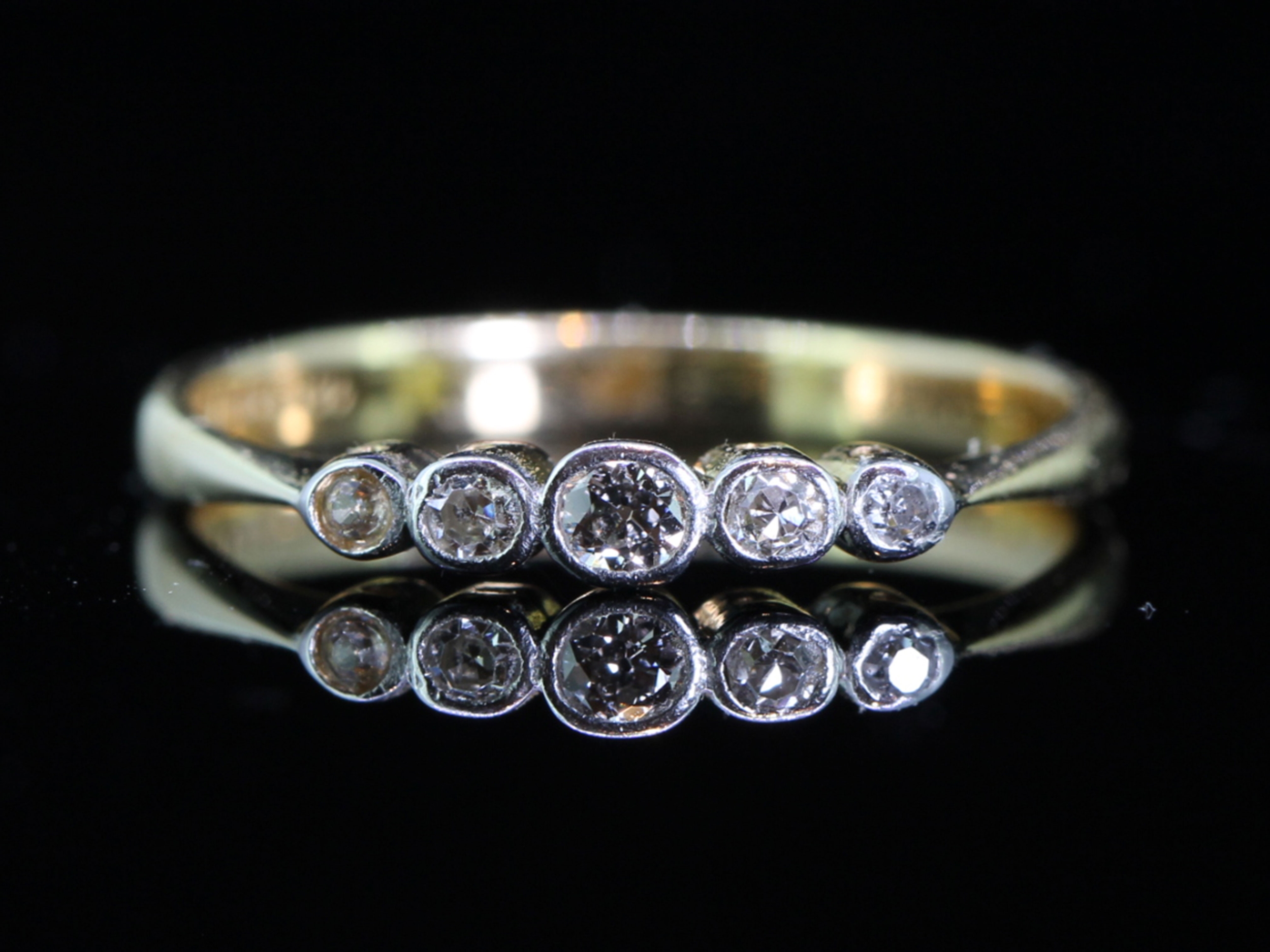 Pretty 18 carat gold and platinum art deco five stone diamond ring