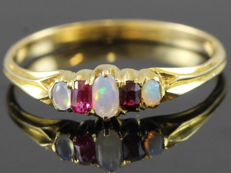 Pretty ruby and opal edwardian 18 carat gold ring