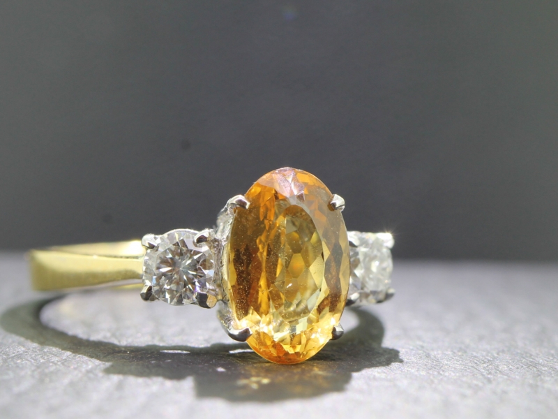 Fabulous imperial topaz and diamond trilogy 18 carat gold ring