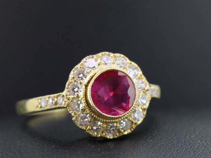 Luxurious ruby and diamond 18 carat gold halo ring