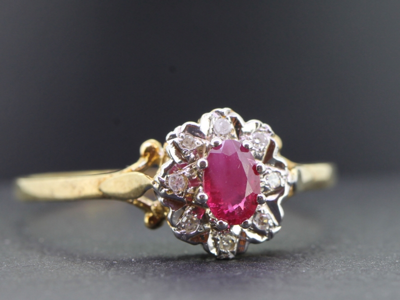 Pretty ruby and diamond 9 carat gold cluster ring