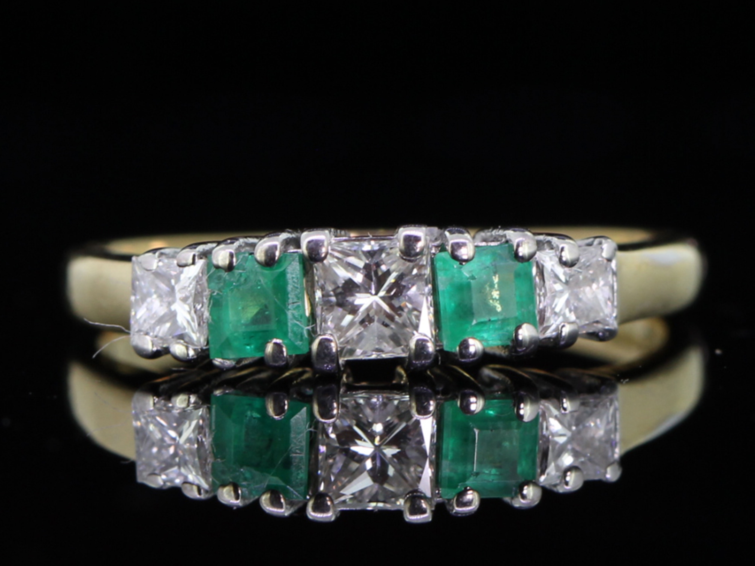 Classic emerald and diamond 18 carat gold ring