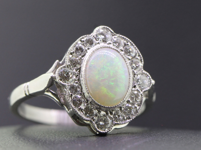 Beautiful opal and diamond cluster platinum ring