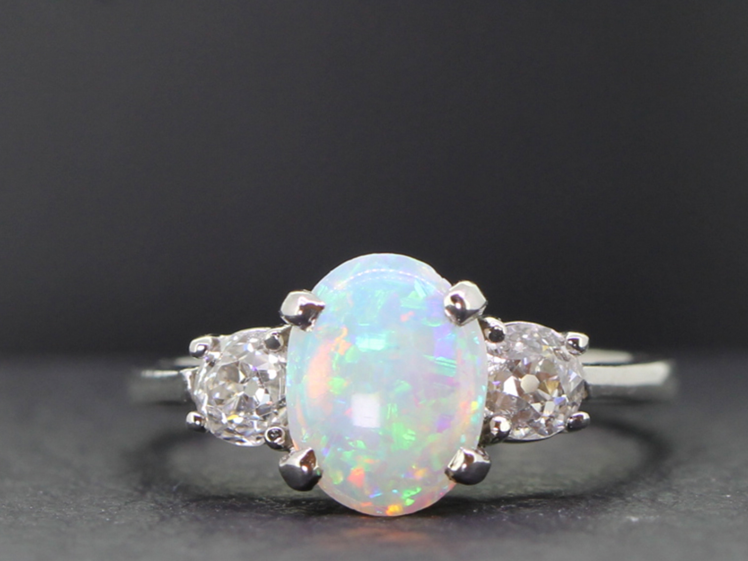 Stylish circa 1920s opal and diamond platinum trilogy ring