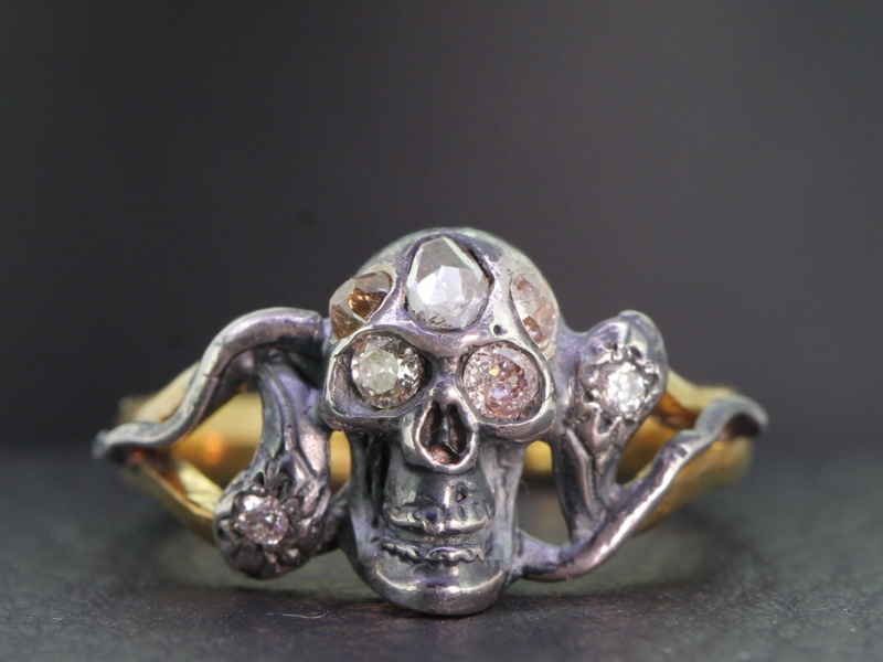 Magnificent 22 carat gold silver set diamond skull and serpent ring
