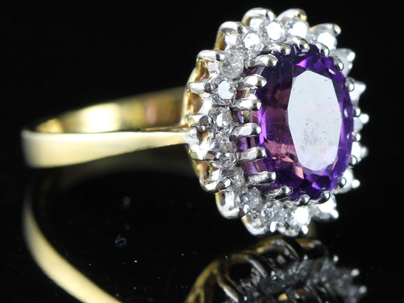 Beautiful amethyst and diamond cluster 18 carat gold ring