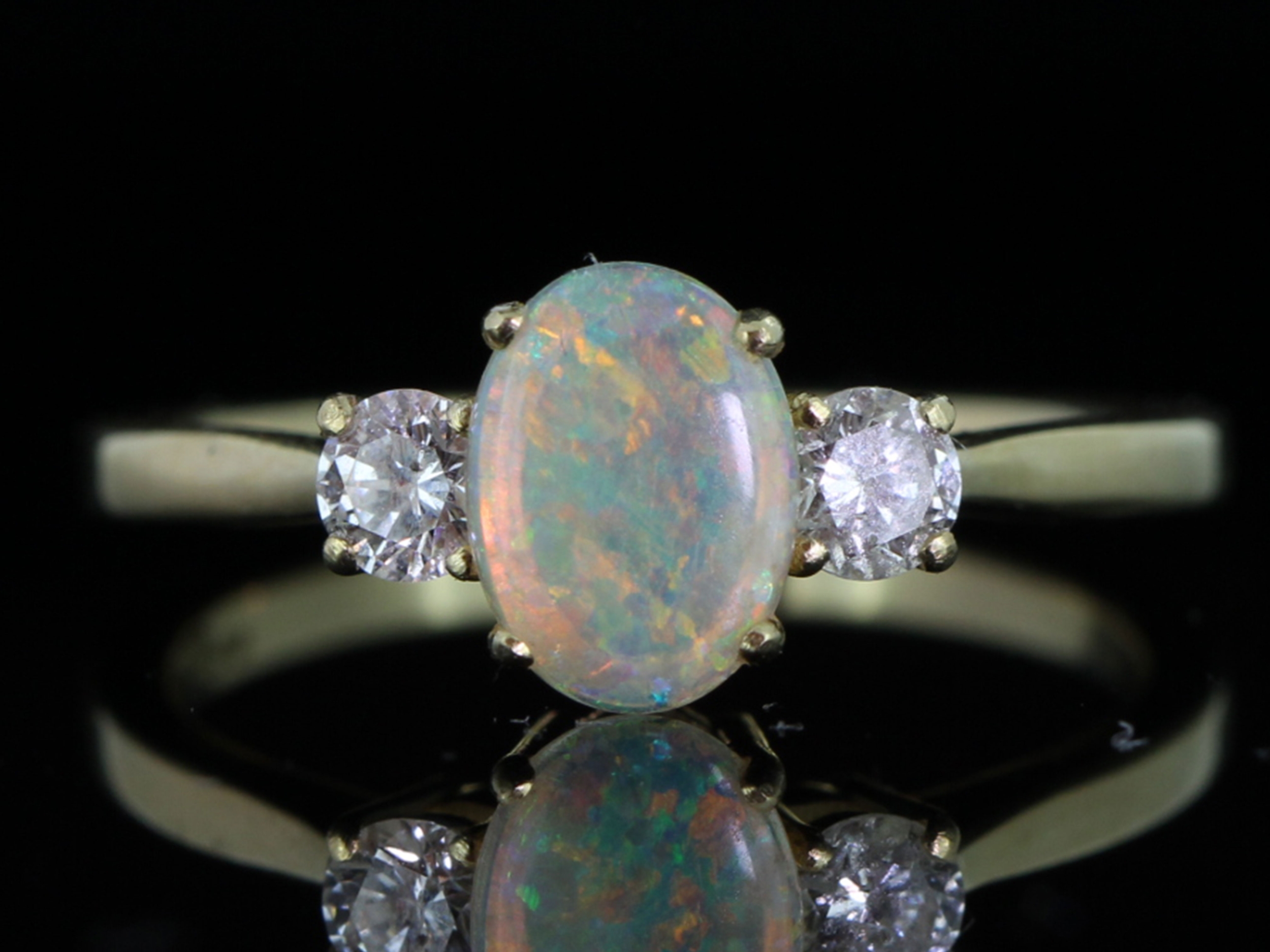 Beautiful australian opal and diamond 18 carat gold trilogy ring