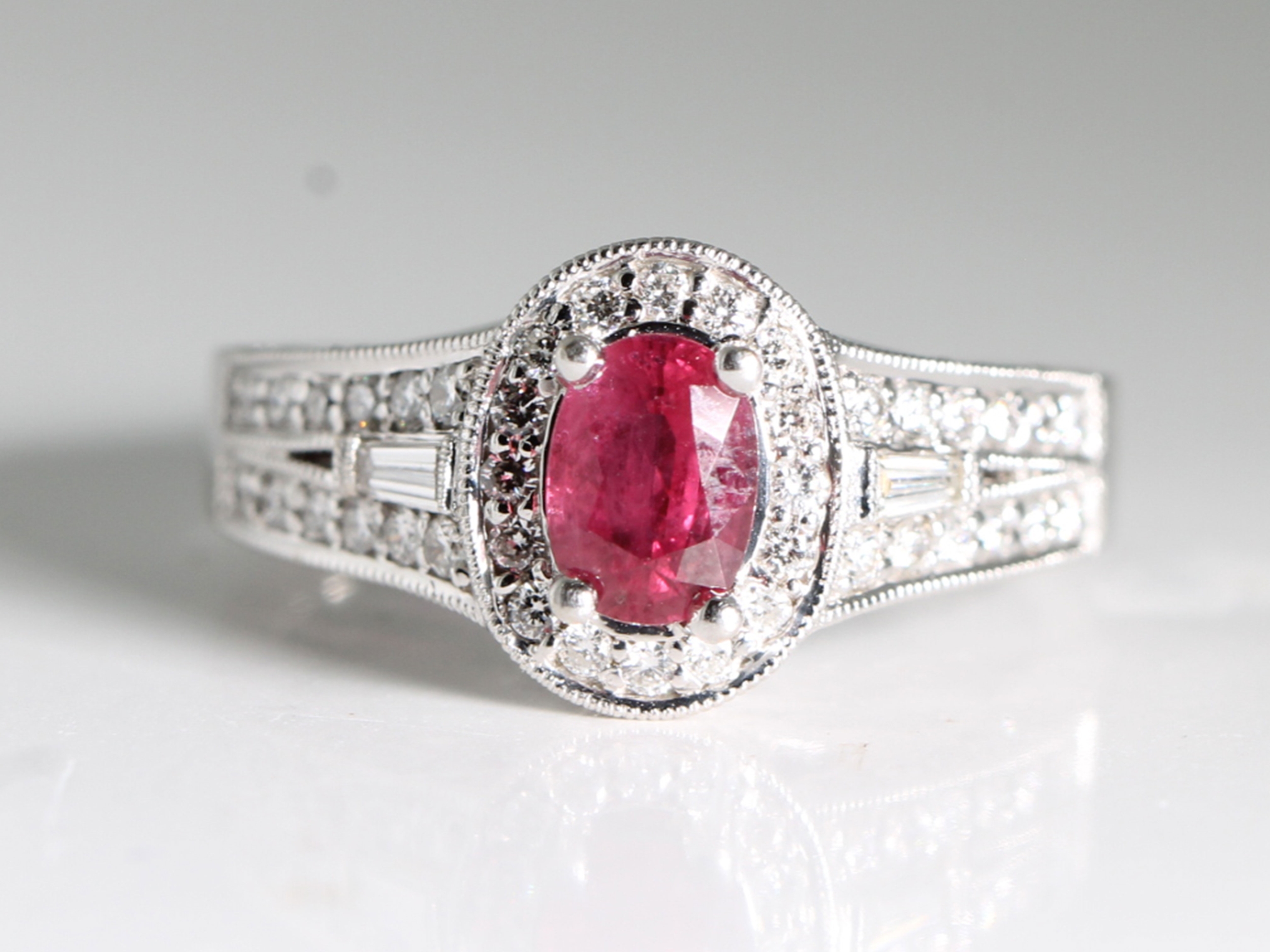 An estate ruby and diamond 18ct white gold cluster ring