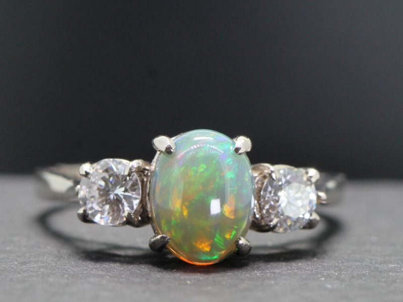 Fabulous black opal and diamond platinum trilogy ring