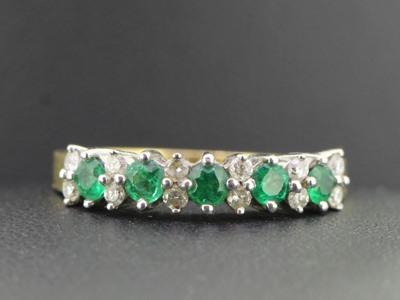  alluring emerald and diamond eternity 18 carat gold ring
