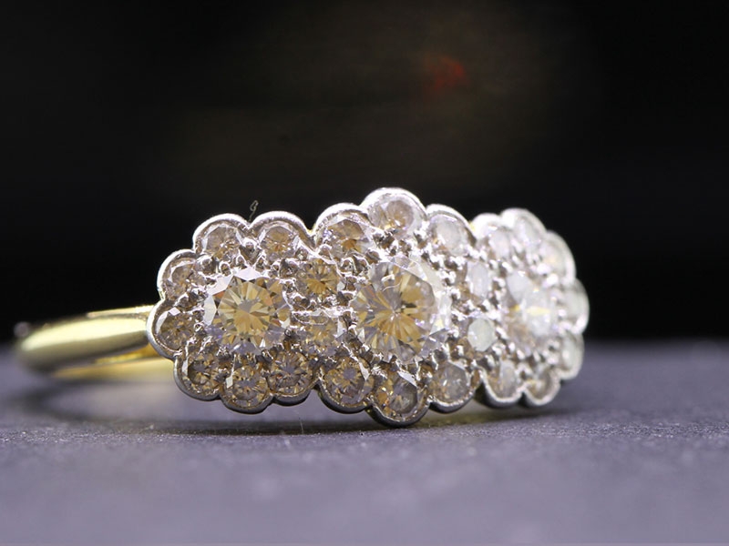Romantic triple diamond diasy 18 carat gold ring