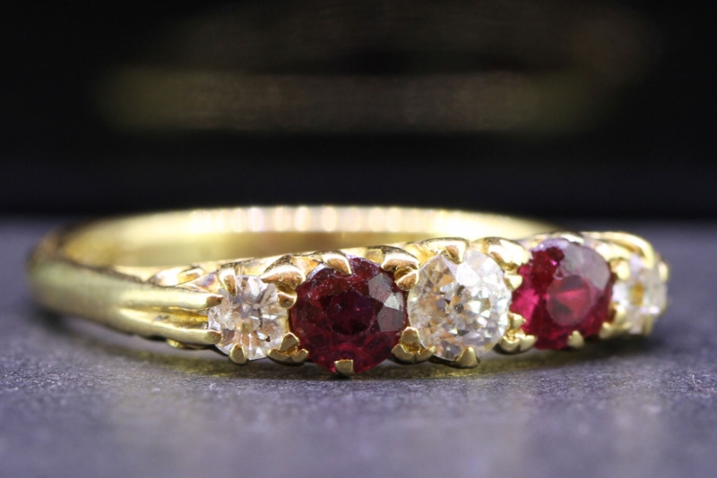 Pretty ruby and diamond 18 carat gold gypsy ring